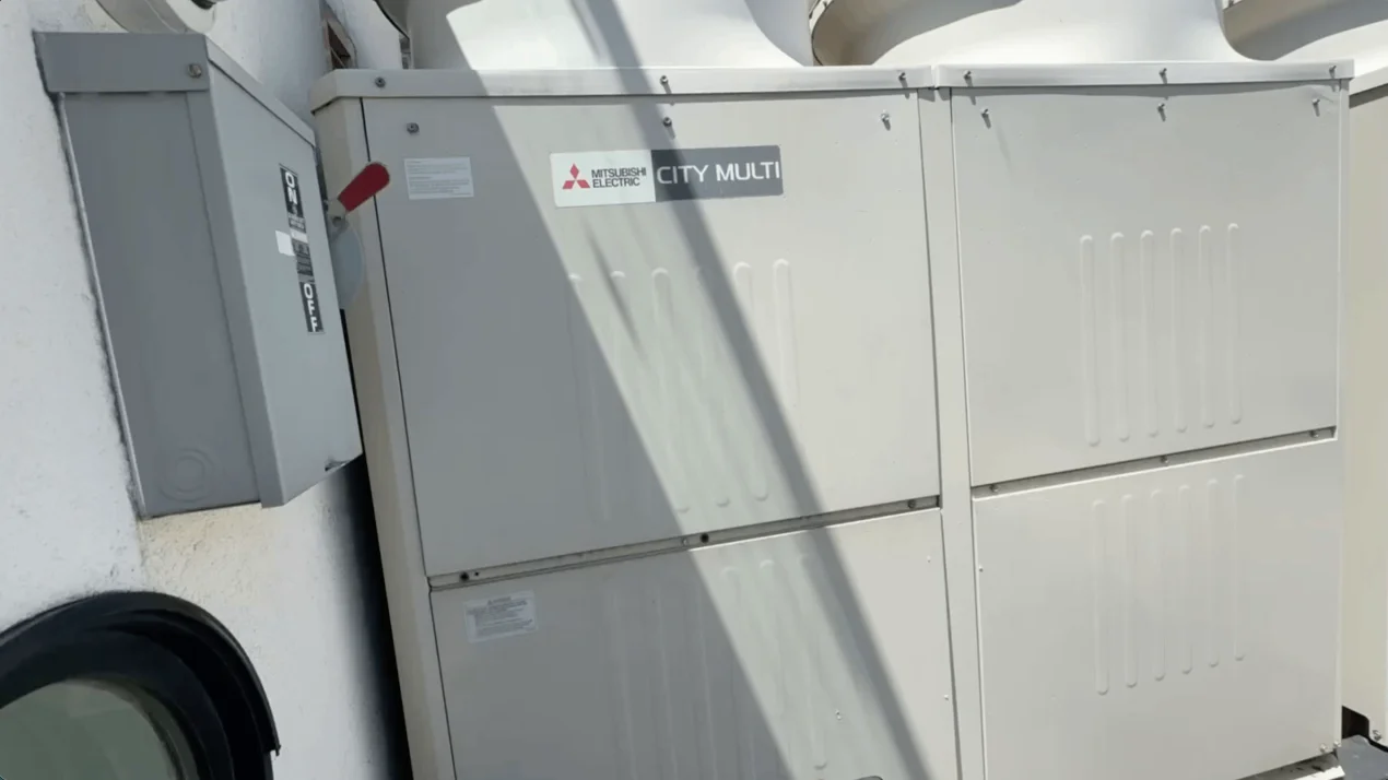 HVAC technician servicing an air conditioning system